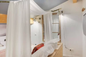 Loft room with double bed and false window