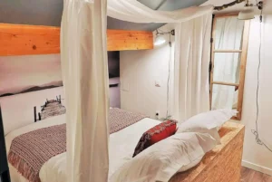 Loft room with double bed and false window