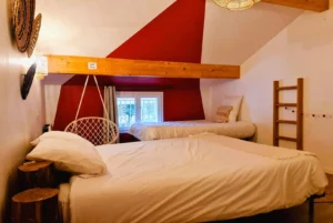 Room with double bed and single bed Loft Nature Bien Etre vacation rental booking