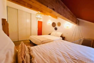 Room with double bed and single bed Loft Nature Bien Etre vacation rental booking