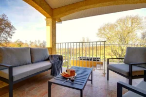 Terrace with garden furniture and outdoor dining table overlooking the countryside