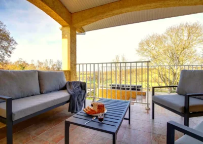Terrace with garden furniture and outdoor dining table overlooking the countryside