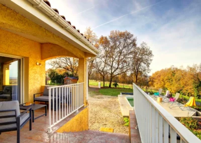 Terrace with garden furniture and outdoor dining table overlooking the countryside