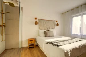 Master bedroom with queen-size bed, walk-in closet and en-suite shower room