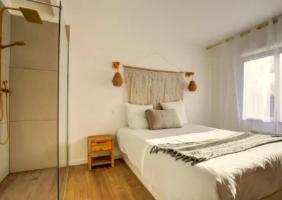 Master bedroom with queen-size bed, walk-in closet and en-suite shower room