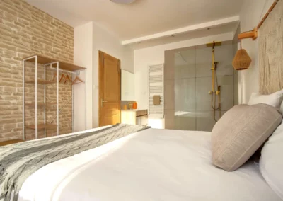 Master bedroom with queen-size bed, walk-in closet and en-suite shower room