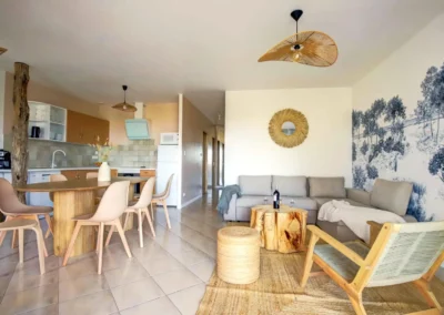 Open-plan living room with sofa bed overlooking dining room for 6 and fully equipped open kitchen