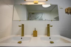 Bathroom with double sink and heated towel rail