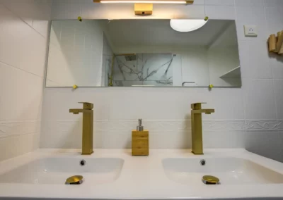 Bathroom with double sink and heated towel rail