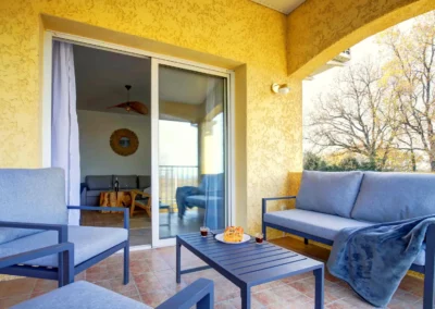 Terrace with garden furniture and outdoor dining table overlooking the countryside
