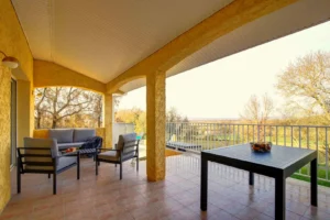 Terrace with garden furniture and outdoor dining table overlooking the countryside
