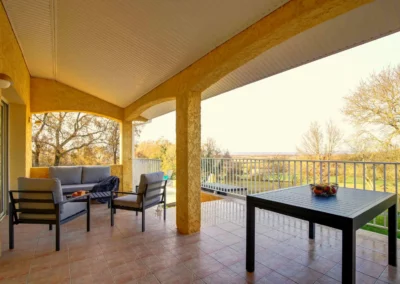 Terrace with garden furniture and outdoor dining table overlooking the countryside