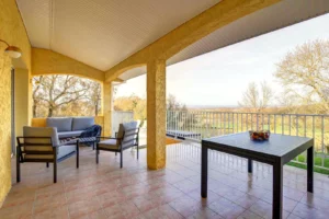 Terrace with garden furniture and outdoor dining table overlooking the countryside