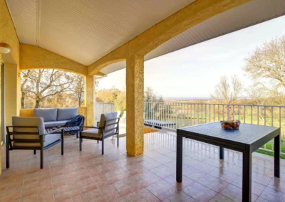 Terrace with garden furniture and outdoor dining table overlooking the countryside