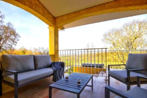 Terrace with garden furniture and outdoor dining table overlooking the countryside