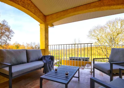 Terrace with garden furniture and outdoor dining table overlooking the countryside